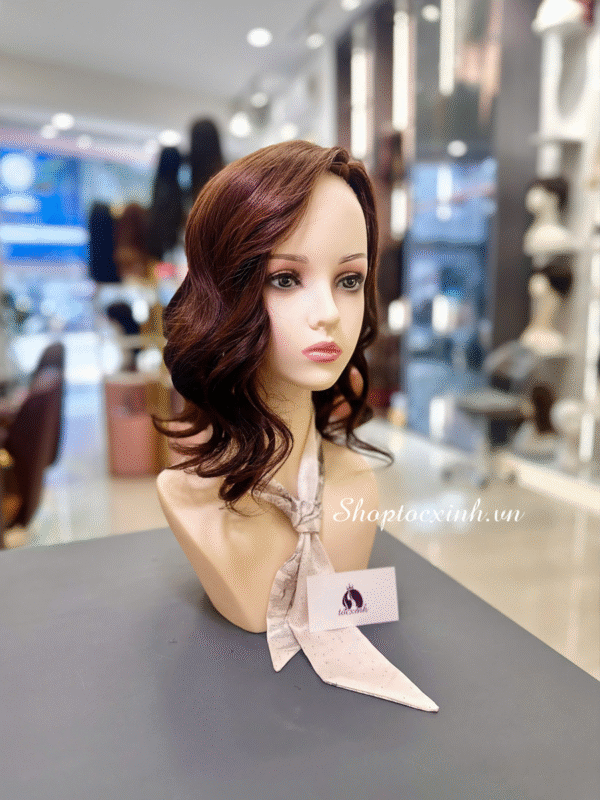 Wig display with stylish hairstyle.